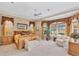 This spacious main bedroom features a large bay window and plush carpeting at 560 Misty Pine Dr, Venice, FL 34292