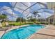 Beautiful pool with spa and screened enclosure offers privacy and stunning golf course views at 560 Misty Pine Dr, Venice, FL 34292