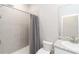 A well-lit bathroom with a shower-tub combination, white vanity, and modern fixtures at 5767 Woodland Sage Dr, Sarasota, FL 34238