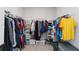 Walk-in closet with ample hanging space, shelving, and organized storage solutions at 5767 Woodland Sage Dr, Sarasota, FL 34238