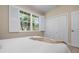 Bedroom featuring plantation shutters, natural light, and closet at 612 Poinsettia Dr, Venice, FL 34285