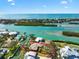 Stunning aerial view of waterfront home with boat dock and lush landscaping, nestled in a coastal community near the open ocean at 641 Bayshore Rd, Nokomis, FL 34275