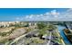 Aerial view of the community showcasing lush landscaping, covered parking, and waterway access at 6415 Midnight Pass Rd # 909, Sarasota, FL 34242