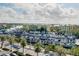 Aerial view of boat storage and yellow condos at 6415 Midnight Pass Rd # 909, Sarasota, FL 34242