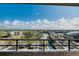 Enjoy serene water views from this balcony with its calming vista of boats and cityscape at 6415 Midnight Pass Rd # 909, Sarasota, FL 34242