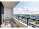 Balcony view overlooking a marina with chairs, offering a serene outdoor space to relax at 6415 Midnight Pass Rd # 909, Sarasota, FL 34242