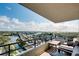Relaxing balcony featuring comfortable seating and a stunning view of the water and bridge traffic at 6415 Midnight Pass Rd # 909, Sarasota, FL 34242