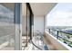 Balcony featuring seating and sliding glass doors, providing a peaceful outdoor retreat at 6415 Midnight Pass Rd # 909, Sarasota, FL 34242