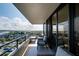 Balcony with comfortable furniture to enjoy the views of the marina at 6415 Midnight Pass Rd # 909, Sarasota, FL 34242