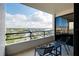 Relaxing balcony featuring seating and a beautiful view of the surrounding intercoastal waterway at 6415 Midnight Pass Rd # 909, Sarasota, FL 34242