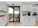 Kitchen area featuring a coffee bar with sliding glass doors to a balcony at 6415 Midnight Pass Rd # 909, Sarasota, FL 34242