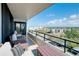 Relaxing balcony featuring comfortable seating and a beautiful view of the surrounding area at 6415 Midnight Pass Rd # 909, Sarasota, FL 34242