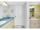 Bathroom featuring a vanity with ample storage and a white countertop basin at 6415 Midnight Pass Rd # 909, Sarasota, FL 34242