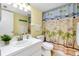 Bathroom featuring a white vanity, countertop basin, and a beach themed shower curtain at 6415 Midnight Pass Rd # 909, Sarasota, FL 34242
