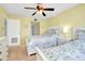 Bedroom featuring twin beds, ceiling fan and ensuite bathroom access at 6415 Midnight Pass Rd # 909, Sarasota, FL 34242