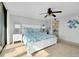 Bright bedroom with a ceiling fan, and colorful bedding at 6415 Midnight Pass Rd # 909, Sarasota, FL 34242