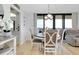 Cozy dining area with a round table, pendant lighting, and balcony access with a beautiful view at 6415 Midnight Pass Rd # 909, Sarasota, FL 34242