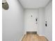 White condo entrance with hardwood floors and a sleek, minimalist design at 6415 Midnight Pass Rd # 909, Sarasota, FL 34242