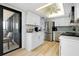 Spacious kitchen features stainless steel appliances, white cabinetry, and bright lighting at 6415 Midnight Pass Rd # 909, Sarasota, FL 34242