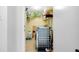 Laundry room with washer, dryer and shelving at 6415 Midnight Pass Rd # 909, Sarasota, FL 34242