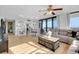 Open floor plan with living room, dining area, and balcony access with beautiful views at 6415 Midnight Pass Rd # 909, Sarasota, FL 34242