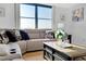 Inviting living room with a cozy sectional sofa, stylish decor, and a scenic view from the large window at 6415 Midnight Pass Rd # 909, Sarasota, FL 34242
