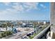 Scenic view showcasing the surrounding cityscape, palm trees, and ocean view at 6415 Midnight Pass Rd # 909, Sarasota, FL 34242