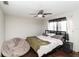 Spacious bedroom with hardwood floors, fan, curtains and a large beanbag chair at 6427 Canary St, Sarasota, FL 34241