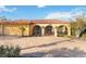 Beautiful Mediterranean-style home with a spacious brick driveway and a terra cotta tile roof at 6427 Canary St, Sarasota, FL 34241