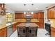 Kitchen with granite countertops, custom cabinets, stainless steel appliances, and tiled flooring at 6427 Canary St, Sarasota, FL 34241