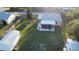 Aerial view of backyard with sheds and water, showcasing the home's backyard and outdoor living potential at 6478 Rosewood Dr, Englewood, FL 34224