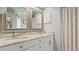 Bathroom with double sink vanity and framed mirrors at 648 Cypress Rd, Venice, FL 34293
