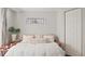 Cozy bedroom featuring a comfy bed, decorative window, and closet at 648 Cypress Rd, Venice, FL 34293