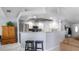 An open kitchen with a breakfast bar and stainless steel appliances at 648 Cypress Rd, Venice, FL 34293