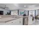 A bright kitchen featuring a stainless steel dishwasher and stainless steel sink at 648 Cypress Rd, Venice, FL 34293