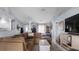 Spacious living room with tile flooring, cozy seating, and open layout perfect for entertaining and Gathering gatherings at 648 Cypress Rd, Venice, FL 34293