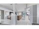 Elegant living room featuring an open layout with tile flooring and access to the kitchen and dining area at 648 Cypress Rd, Venice, FL 34293