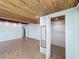 Bedroom featuring wood paneled ceilings, closet, and tile floors at 704 Serata St, Venice, FL 34285