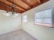 Bright dining area with natural light, tiled floors, and a unique wood ceiling at 704 Serata St, Venice, FL 34285