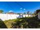 Spacious backyard is enclosed with a white fence at 781 Missouri Rd, Venice, FL 34293