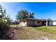 View of backyard with partial brick wall and chain link fence at 781 Missouri Rd, Venice, FL 34293