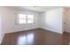 Comfortable bedroom with wood floors, a window, and neutral walls perfect for relaxation at 781 Missouri Rd, Venice, FL 34293