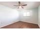 Well-lit bedroom features wood floors, ceiling fan, and a large window providing natural light at 781 Missouri Rd, Venice, FL 34293