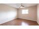 Inviting bedroom with wood floors, ceiling fan, and a window offering a comfortable living space at 781 Missouri Rd, Venice, FL 34293