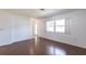 Spacious living room boasting wood floors, natural light, and a view of the front entrance at 781 Missouri Rd, Venice, FL 34293