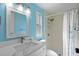 Modern bathroom featuring a white vanity, updated fixtures and glass enclosed shower at 891 Grado Dr, Venice, FL 34285
