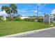 Manicured lawn and landscaping in front of the community clubhouse at 891 Grado Dr, Venice, FL 34285