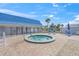 Relaxing hot tub with a paver surround, offering a tranquil retreat for unwinding and soaking up the sun at 891 Grado Dr, Venice, FL 34285