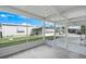 Enclosed patio offering an outdoor living space with views of the lawn at 891 Grado Dr, Venice, FL 34285