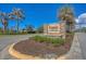 Stone entrance sign for Rapalo, a D.R. Horton Community, surrounded by lush landscaping at 8969 Mondial Ct, Venice, FL 34293